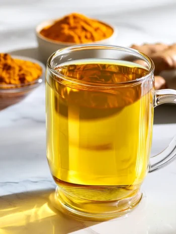 Turmeric tea recipe served hot in a glass mug