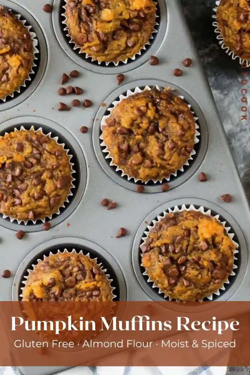 freshly baked almond flour pumpkin muffins in muffin tin with chocolate chips