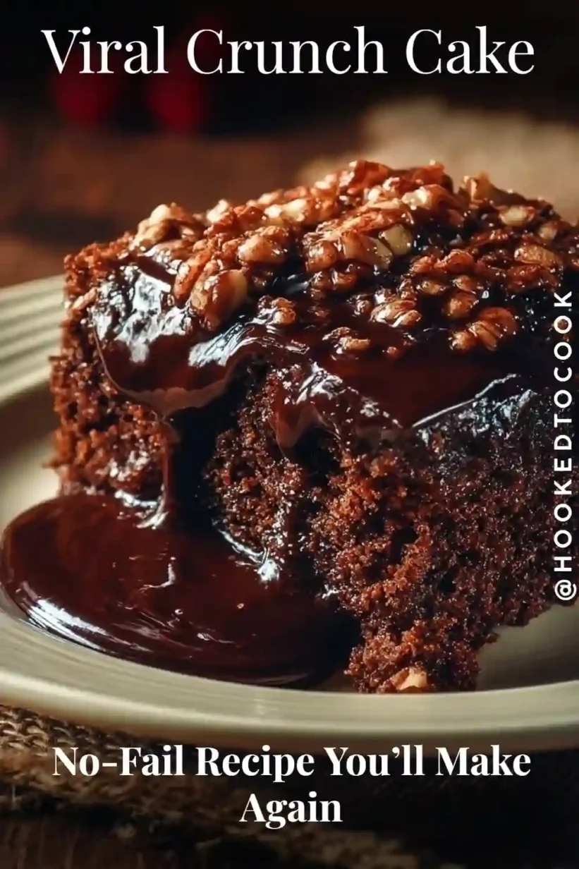 Viral Crunch Cake with gooey chocolate base and caramelized nut topping dripping in chocolate sauce.