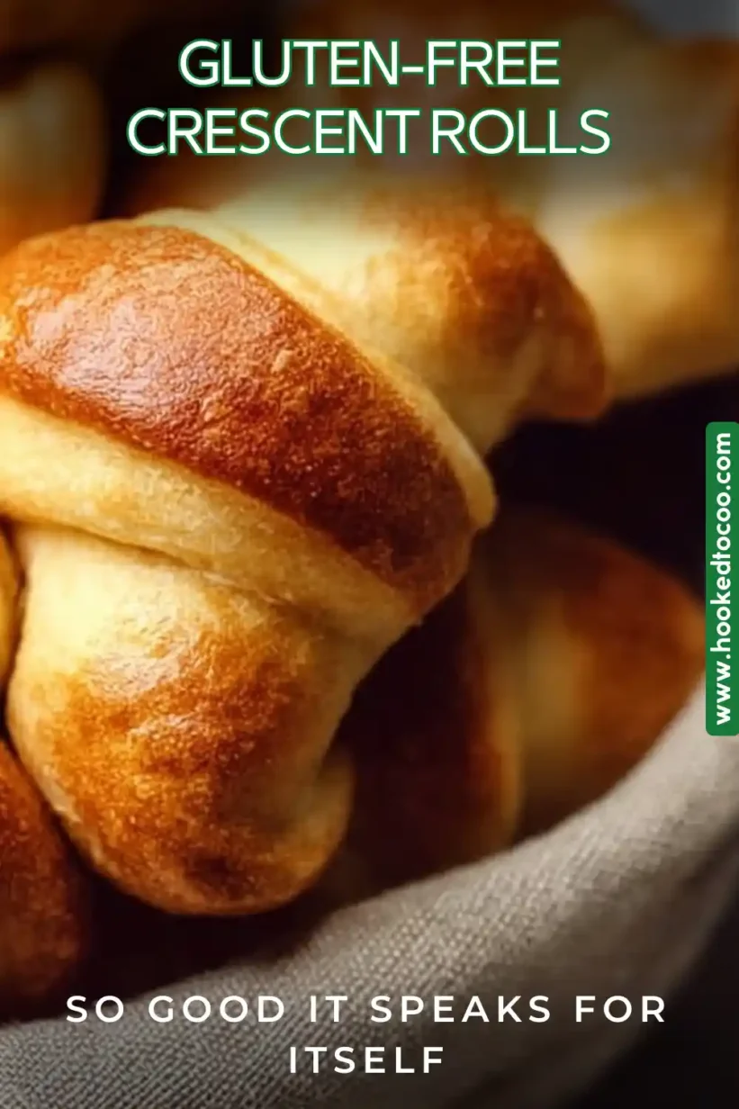  Freshly baked Gluten-Free Crescent Rolls on a baking sheet.