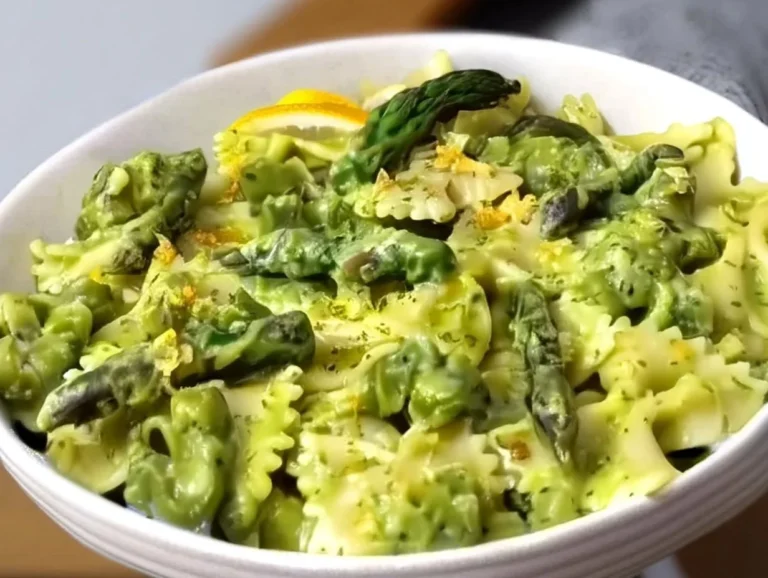 Delicious plate of asparagus pasta garnished with fresh herbs