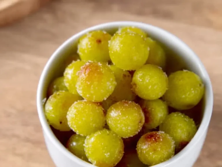 A bowl of frozen grapes, a refreshing and healthy snack option.