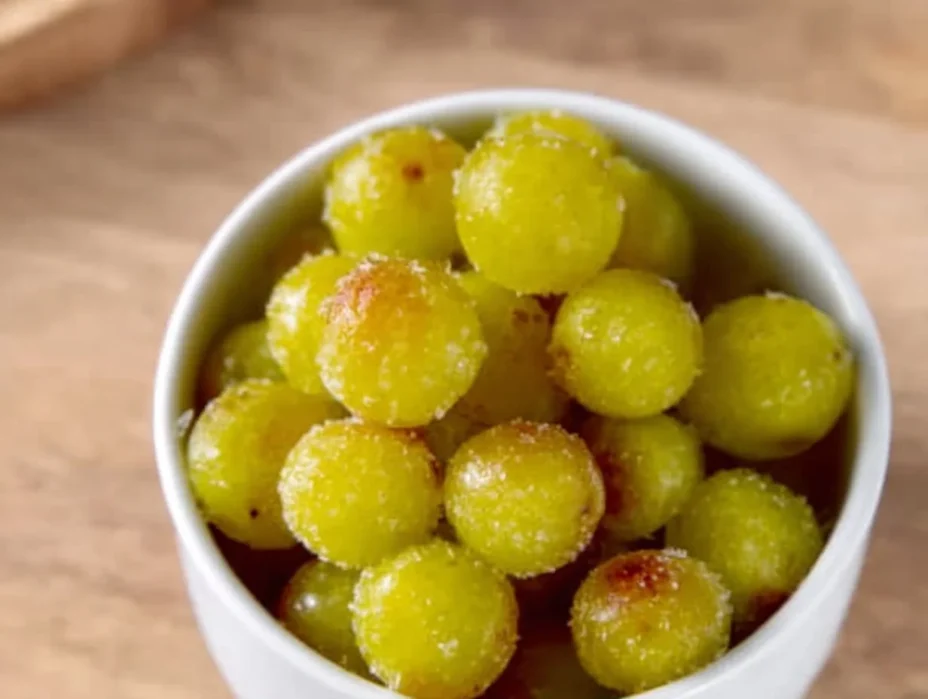 A bowl of frozen grapes, a refreshing and healthy snack option.
