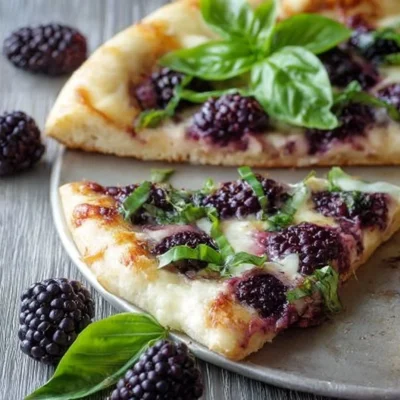Gourmet Blackberry Basil Ricotta Pizza with fresh basil and blackberries