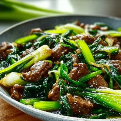 A vibrant plate of Bok Choy Beef Stir-Fry featuring fresh vegetables and tender beef.