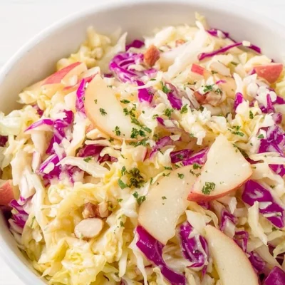 Cabbage Apple Salad with fresh ingredients in a bowl