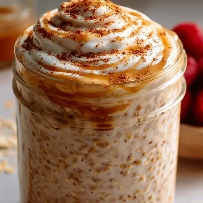 High-protein cinnamon roll overnight oats topped with cinnamon and nuts