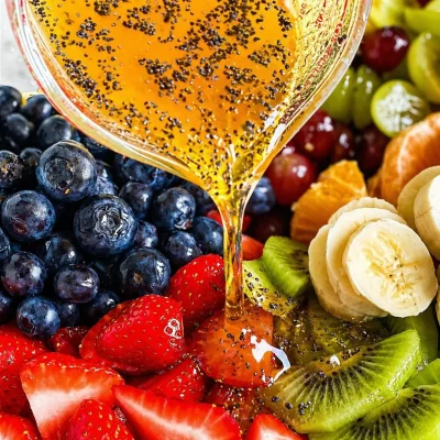 Fresh fruit salad drizzled with poppy seed fruit salad dressing.