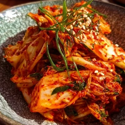 Homemade kimchi in a vibrant bowl, showcasing its colorful ingredients and texture.