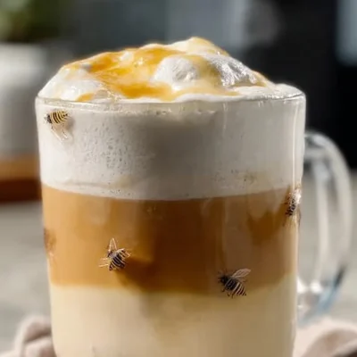 Delicious Honey Bun Latte topped with whipped cream and cinnamon