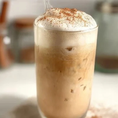 Iced French Toast Latte featuring whipped cream and cinnamon on top