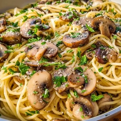 Serving of Mushroom Garlic Spaghetti with fresh parsley on top