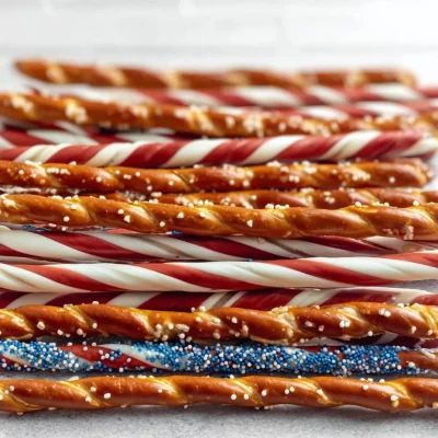 Easy patriotic pretzel rods decorated in red, white, and blue for festive snacks.
