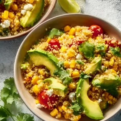 Quinoa corn salad with avocado, vibrant and nutritious dish topped with fresh ingredients.