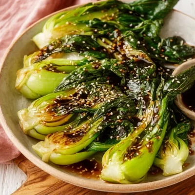Sautéed baby bok choy with ginger sauce served in a bowl