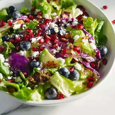 Vibrant blueberry and pomegranate salad with fresh greens