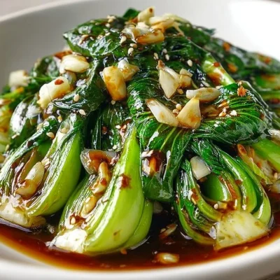 Zesty steamed bok choy served on a plate with lemon slices